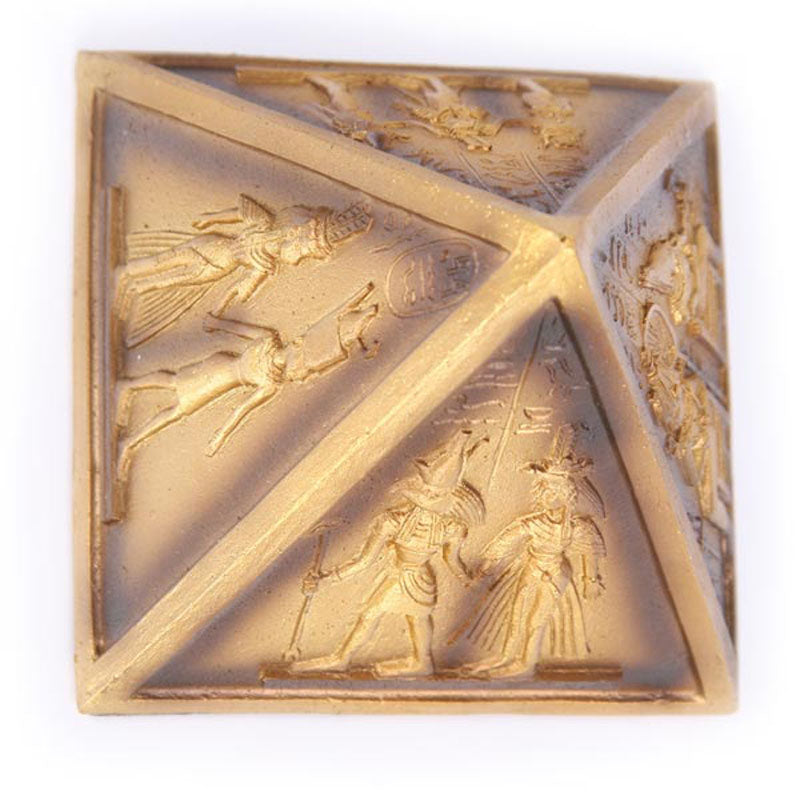 Collectible Gold Egyptian Pyramid Ornament on shelf