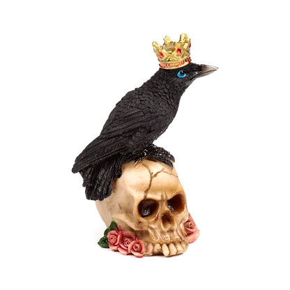 Intricate detailing of crow ornament with skulls