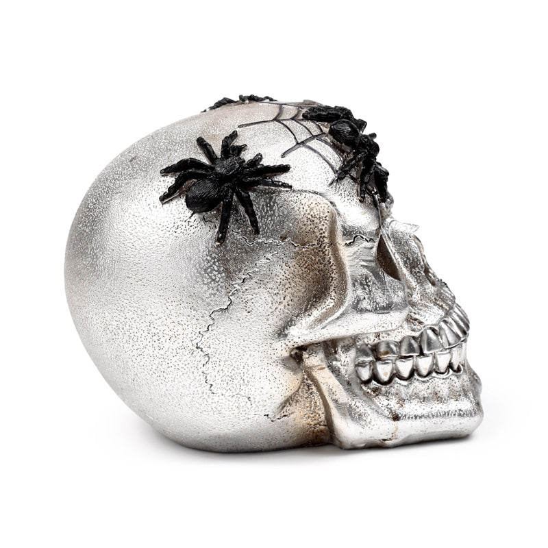 Collectible silver skull with black spiders for gifting