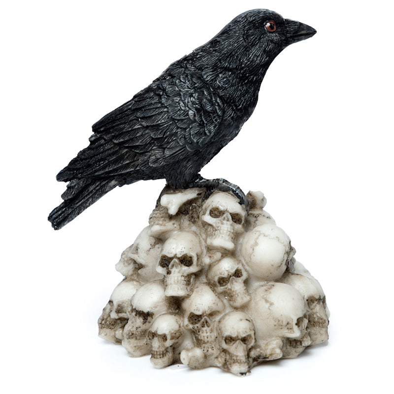 Side view of Crow Standing on Pile of Skulls Ornament