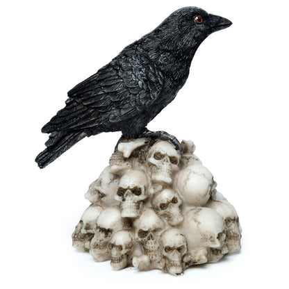 Side view of Crow Standing on Pile of Skulls Ornament