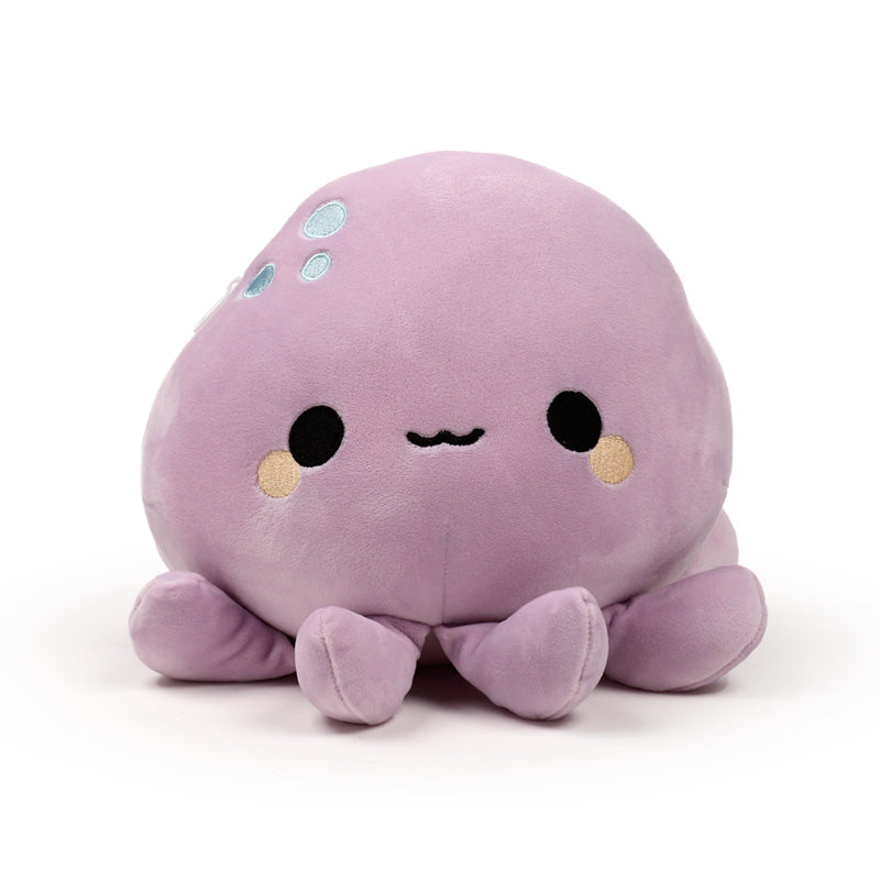 Wendy the Octopus plush toy on a bed