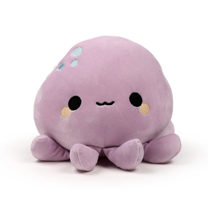 Wendy the Octopus plush toy on a bed