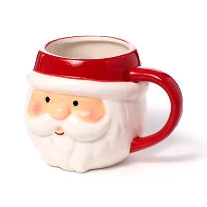 Ceramic Santa head mug displayed with holiday decorations