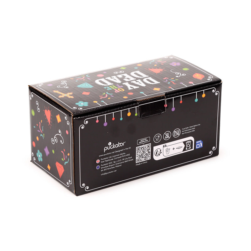 Elegant glass tumblers celebrating Day of the Dead