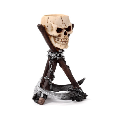 Gothic resin skull head tea light holder with scythe tripod base