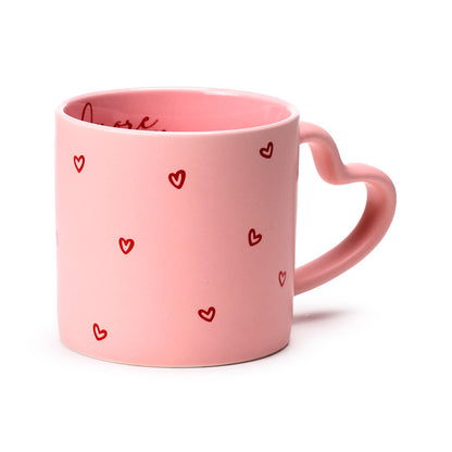 Amore Heart Shaped Handle Mug displayed on a table