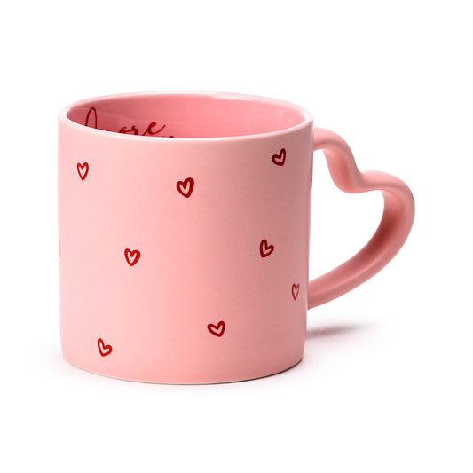 Amore Heart Shaped Handle Mug displayed on a table