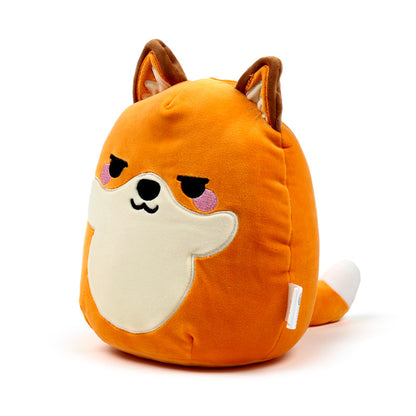 Finnick the Fox plush toy in a cozy setting