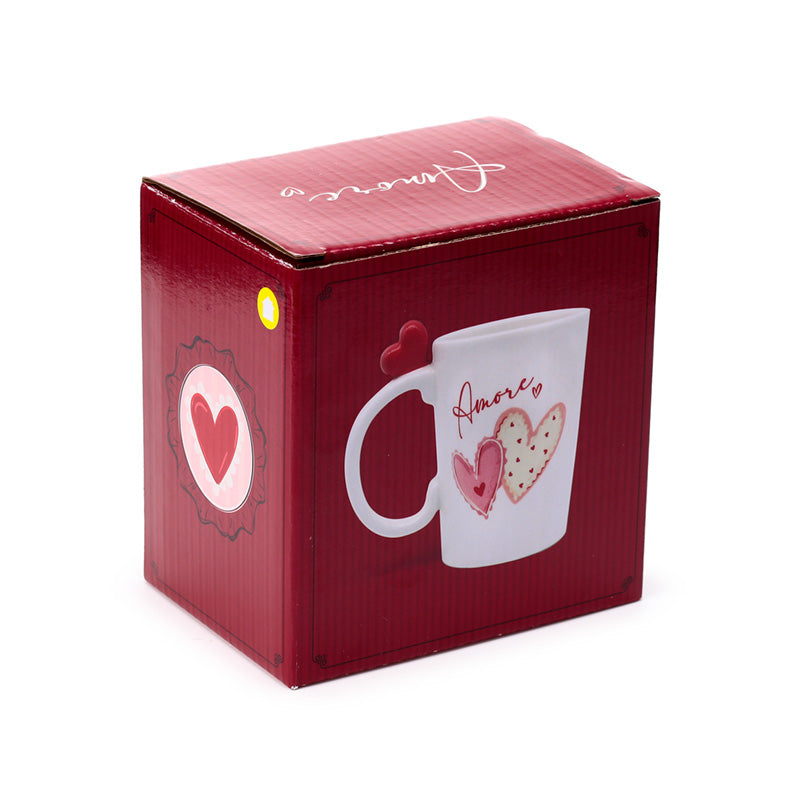 Amore Heart Shaped Handle Ceramic Mug on a shelf