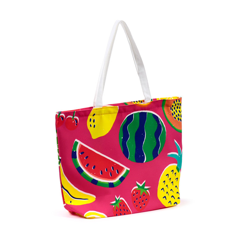 Close-up of summer fruits beach bag
