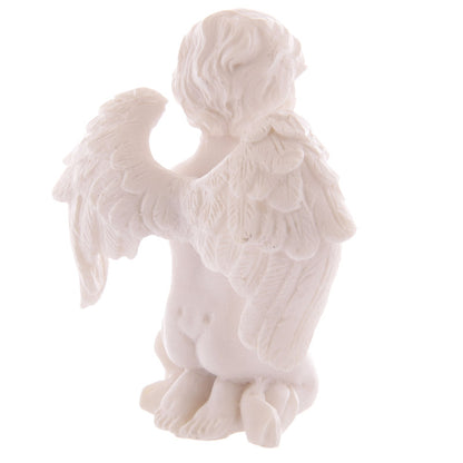 Elegant praying cherub figurine in pastel colours