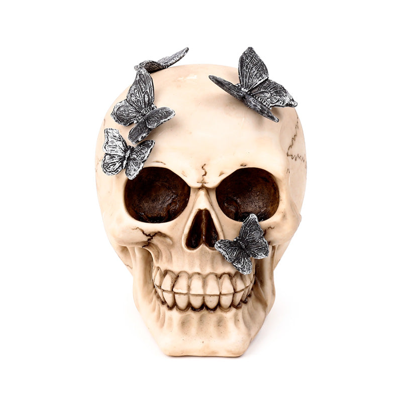 Close-up of skull ornament showcasing metallic butterflies