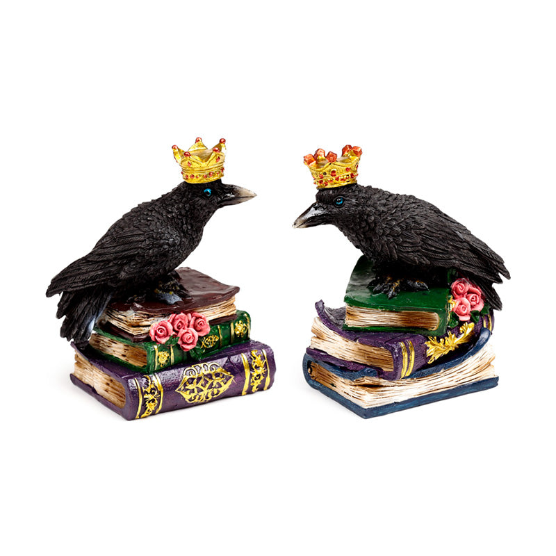 Decorative ornament of a crow wearing a crown on books