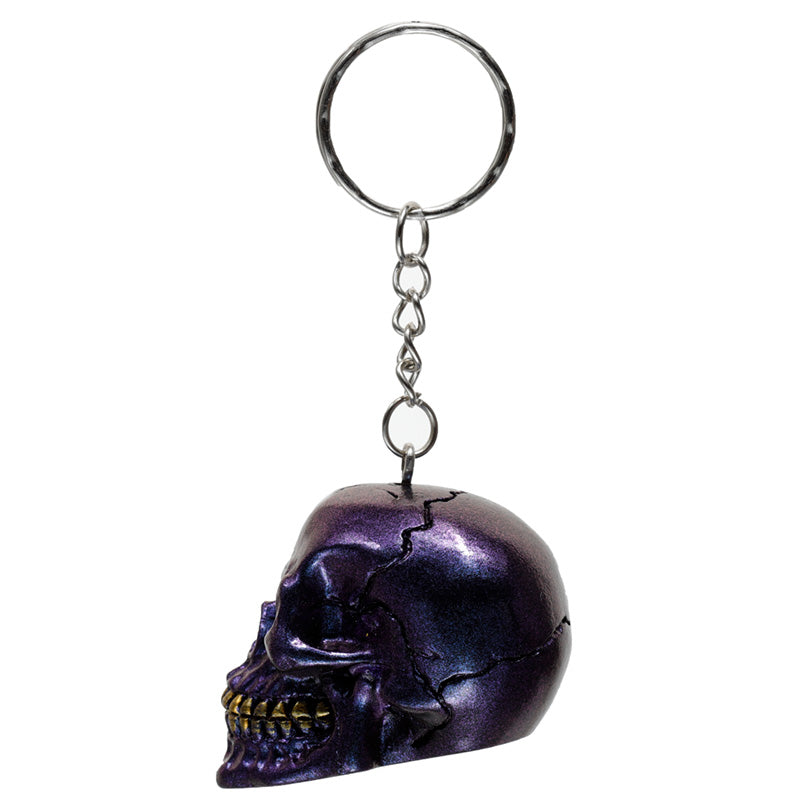 Skulls and Roses Metallic Skull Keyring held in hand