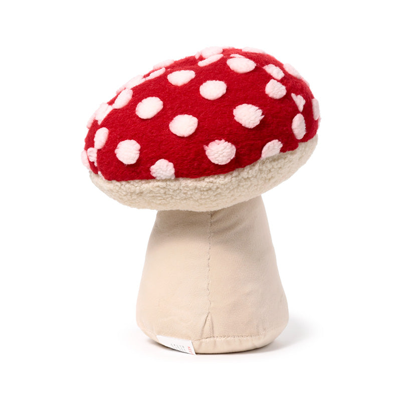Mushroom plush door stop on wooden floor