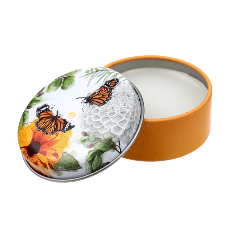Butterfly Meadows Lip Balm displayed with floral decor