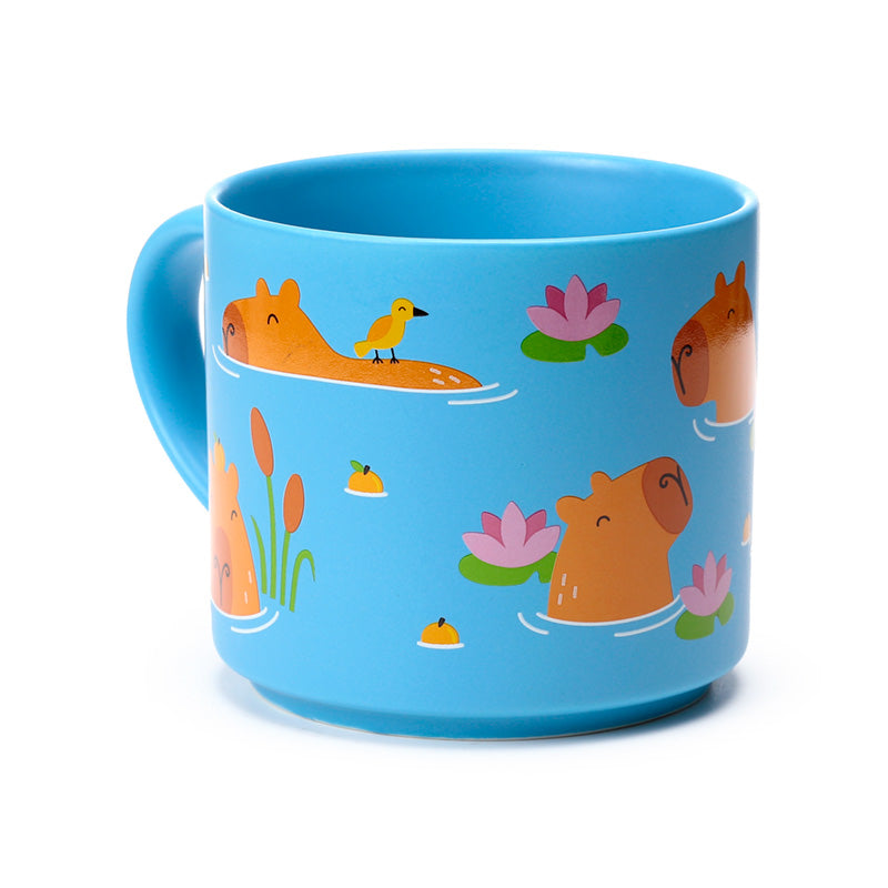Whimsical porcelain mug featuring a capybara
