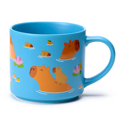 Cute capybara mug displayed with beverages