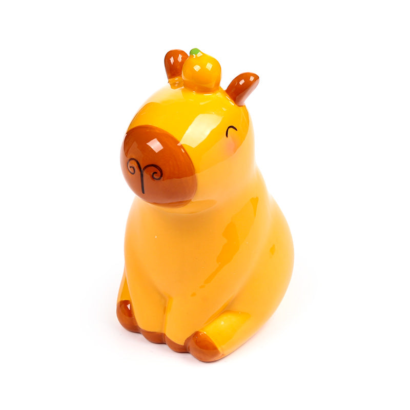 Ceramic capybara money box with coins