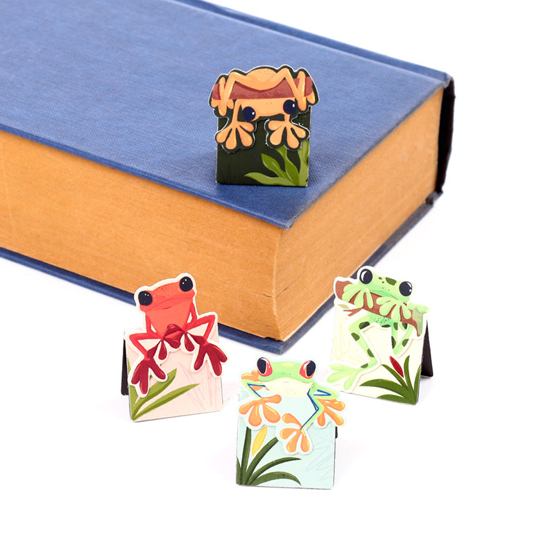 Tropical Frogs Bookmark Set displayed on a book