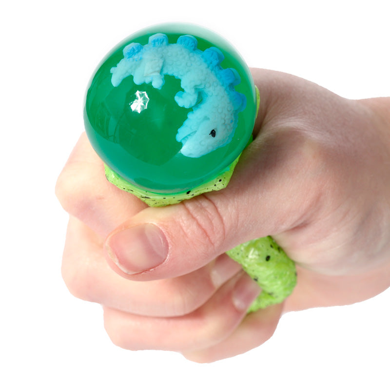 Child squeezing the Fun Kids Squeezy Dino Egg