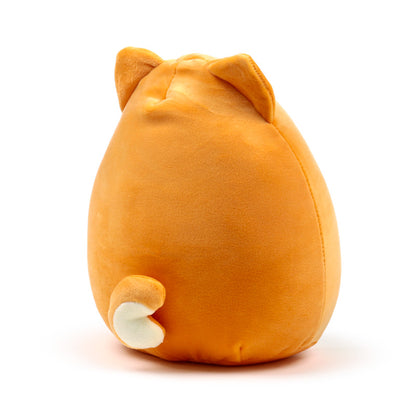 Shuggs the Shiba Inu plush toy on a shelf