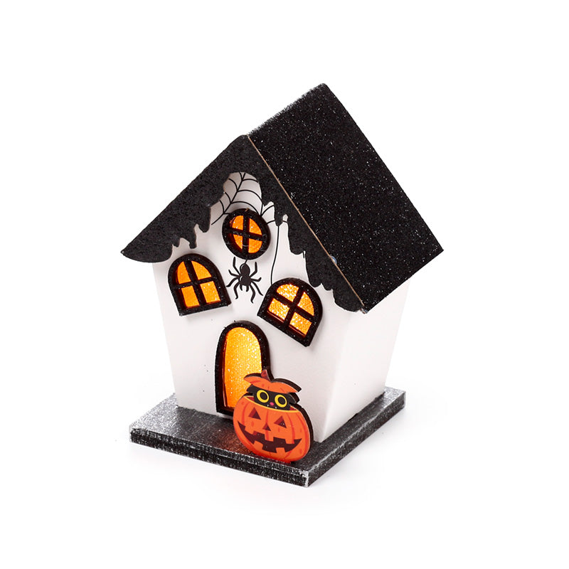 Spooky Pumpkin House illuminated with LED lights