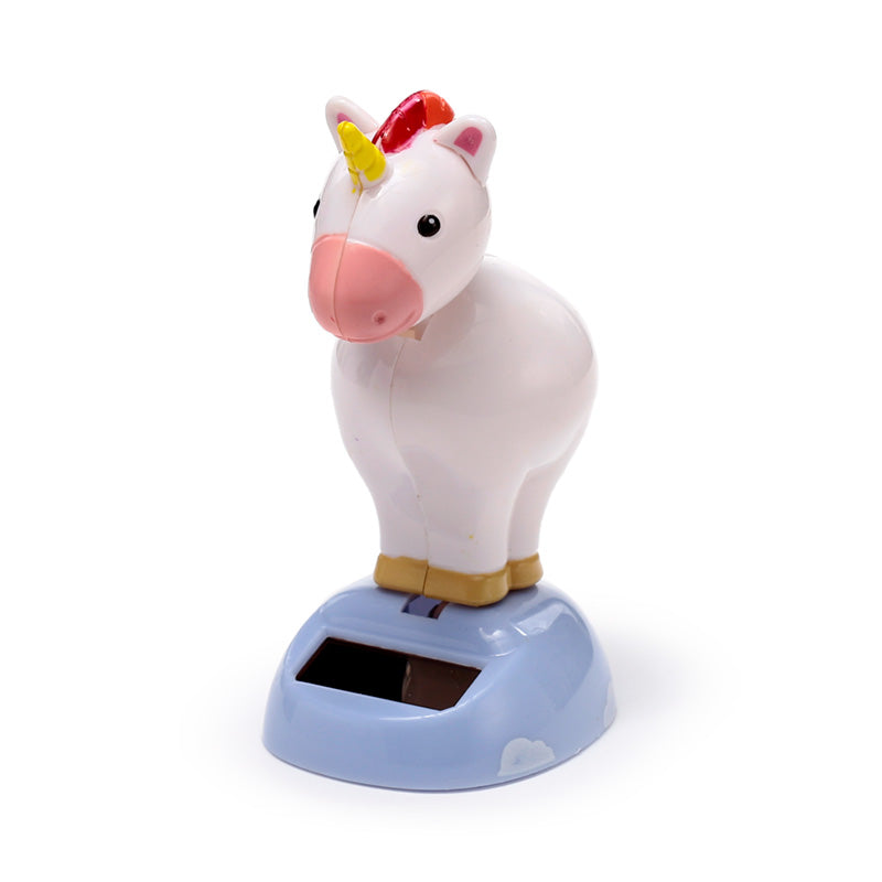 Enchanting unicorn ornament glowing at night