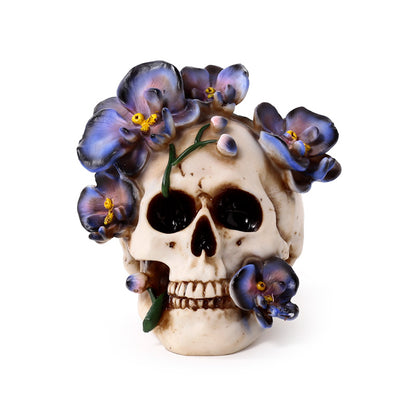 Intricate skull ornament showcasing purple floral details