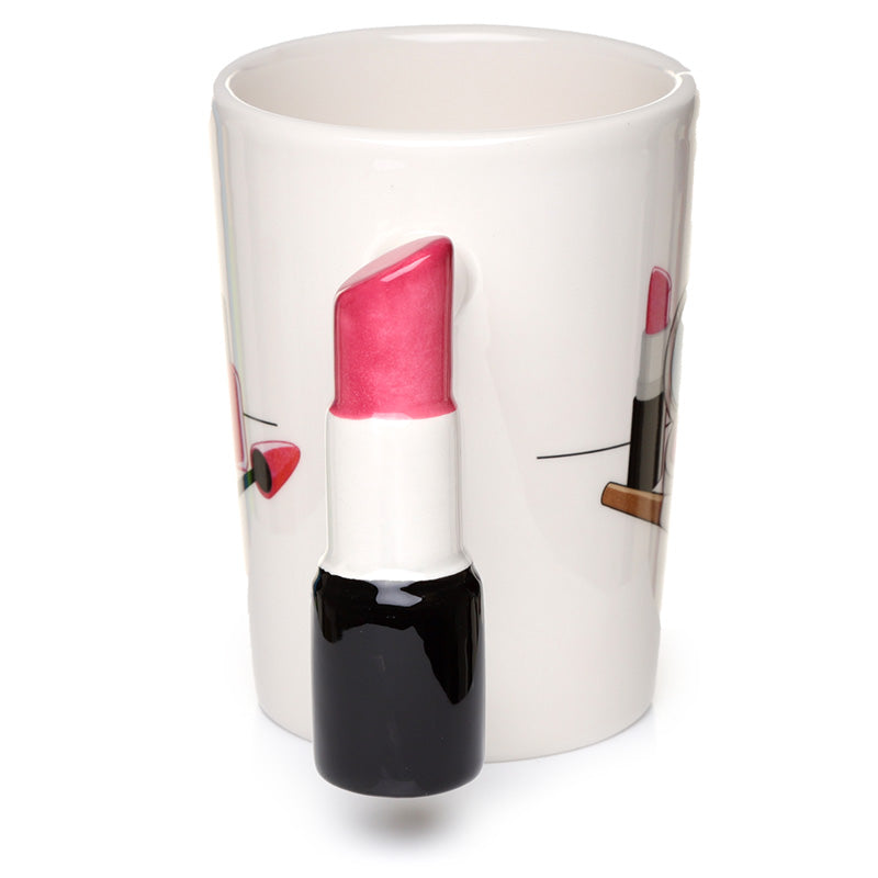 Close-up of lipstick handle on ceramic mug