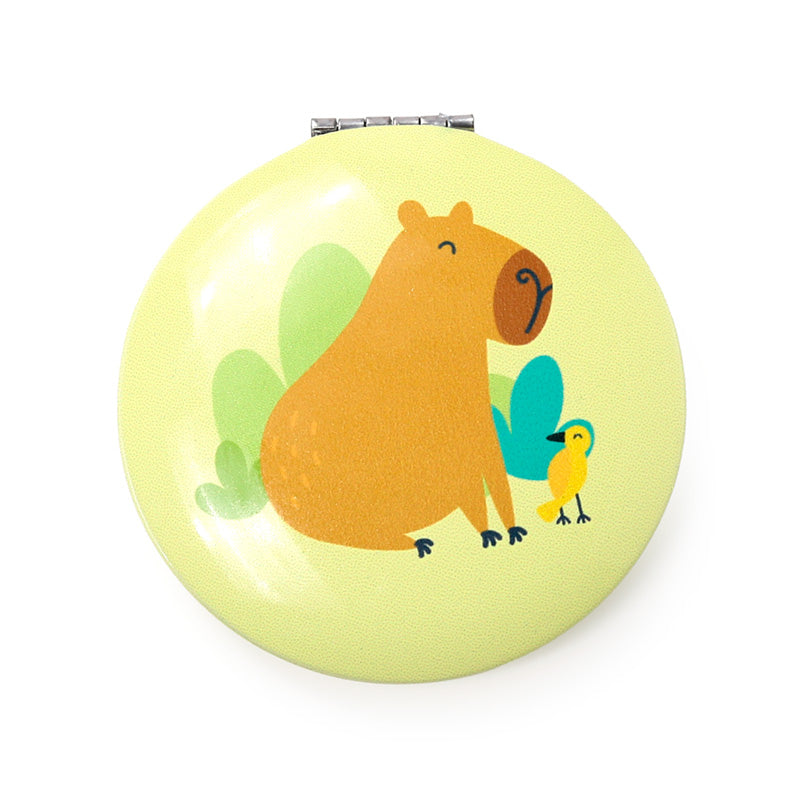 Capybara Compact Mirror displayed on a vanity