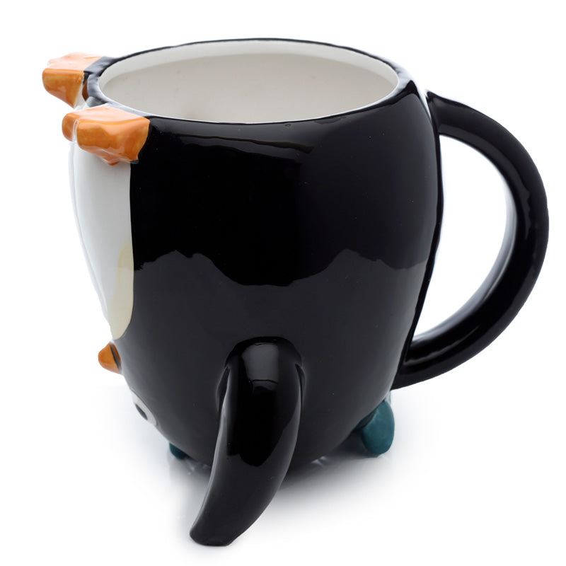 Huddle Penguin mug displayed with other home decor items