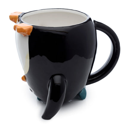 Huddle Penguin mug displayed with other home decor items