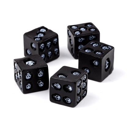 Black Skull Dice displayed with other gaming accessories