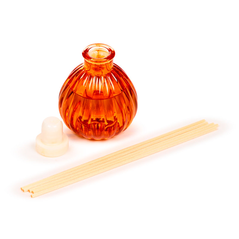 Autumn Harvest Pumpkin Reed Diffuser with autumn leaves