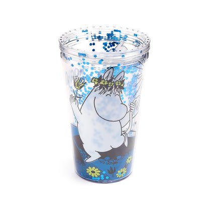 Moomin cup with straw on a picnic table