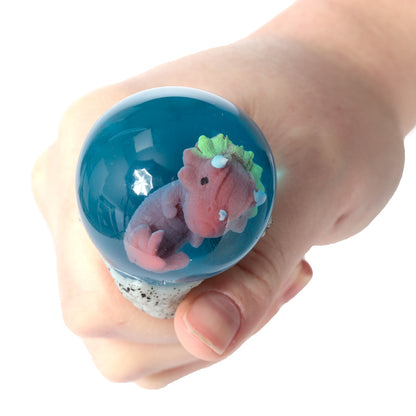 Fun Kids Squeezy Dino Egg displayed with other toys