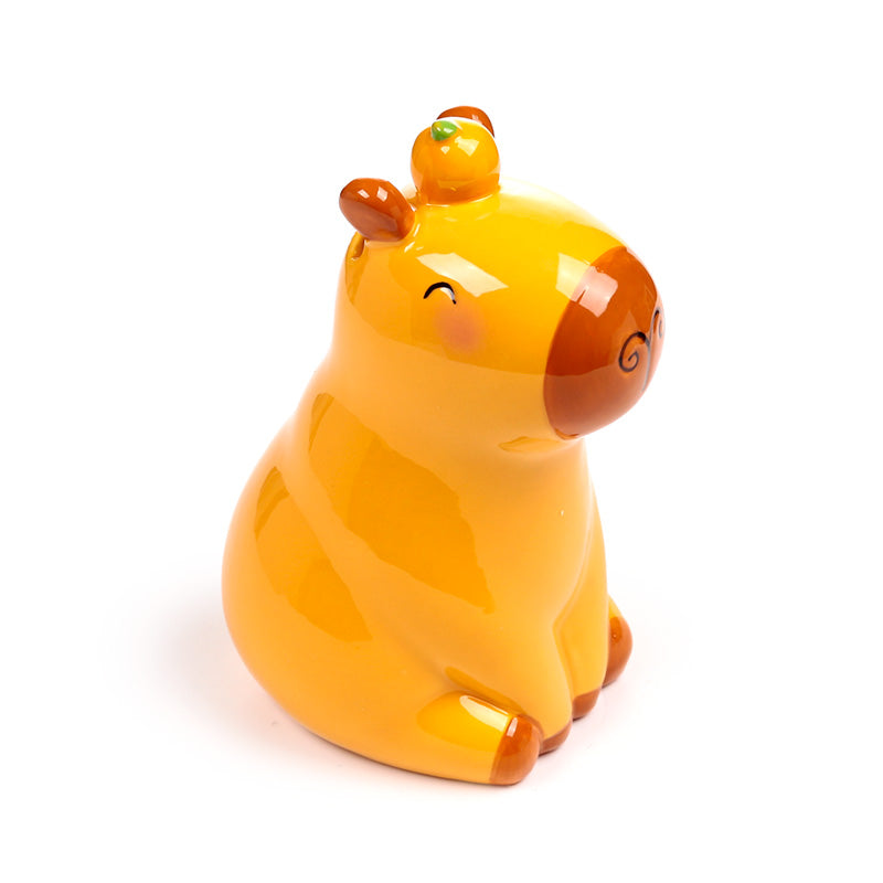 Capybara money box on a desk