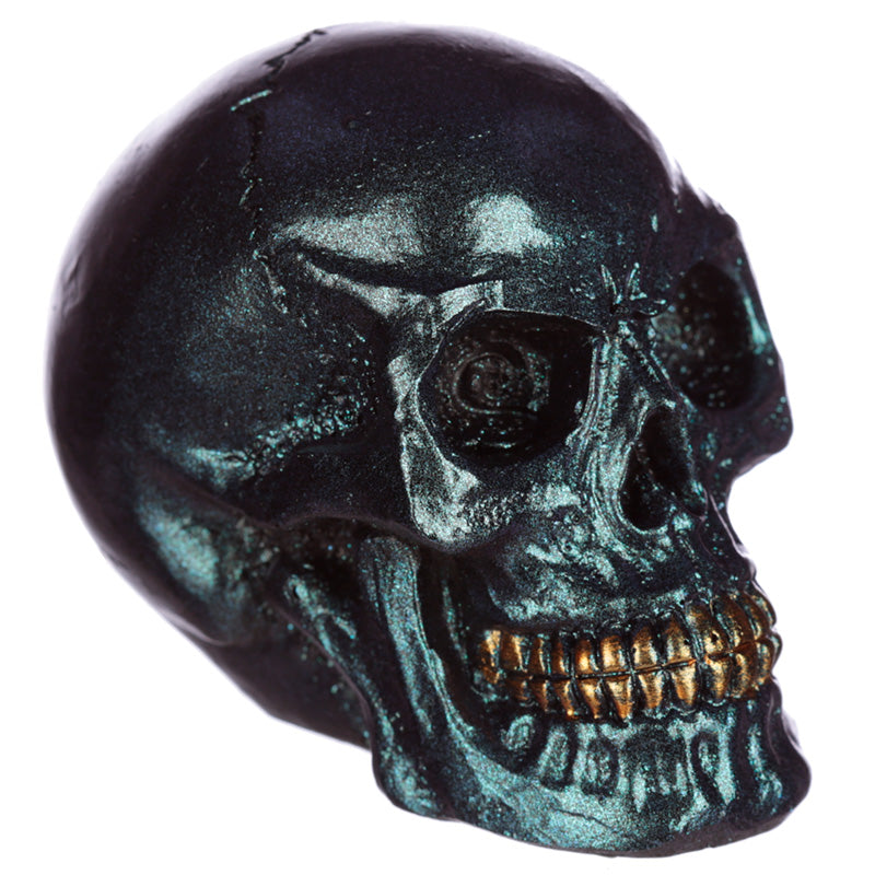 Gothic Iridescent Skull Ornament displayed on a shelf