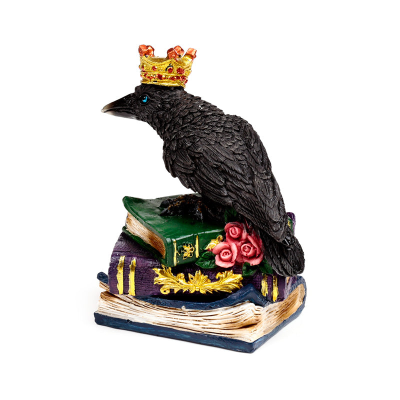 Regal crow ornament atop books