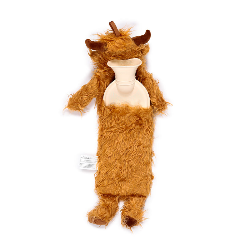 Highland Coo Hot Water Bottle on a cozy blanket