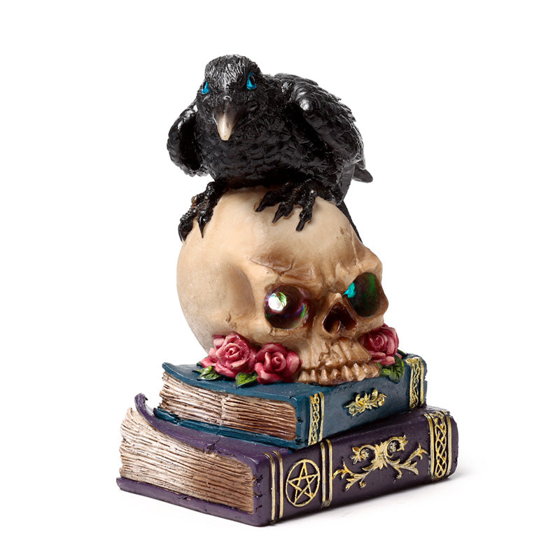 Decorative LED crow on skull and books display piece