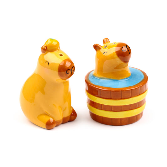 Capybara ceramic salt and pepper shakers on a table