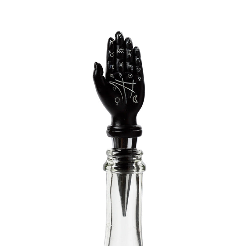 Novelty bottle stopper displayed with wine glasses