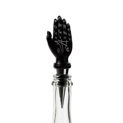 Novelty bottle stopper displayed with wine glasses