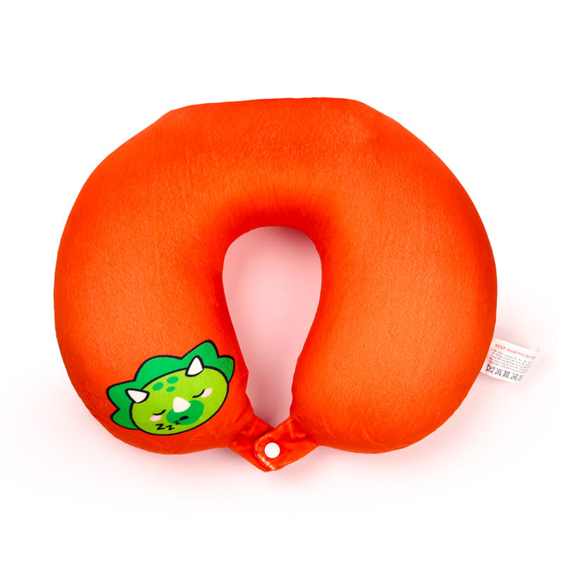 Huck the Dinosaur as a horseshoe travel pillow