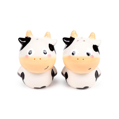 Ceramic salt and pepper set featuring a black and white cow design