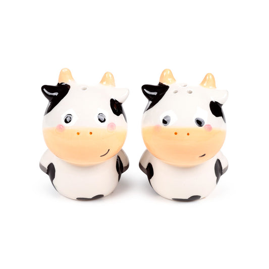 Ceramic salt and pepper set featuring a black and white cow design