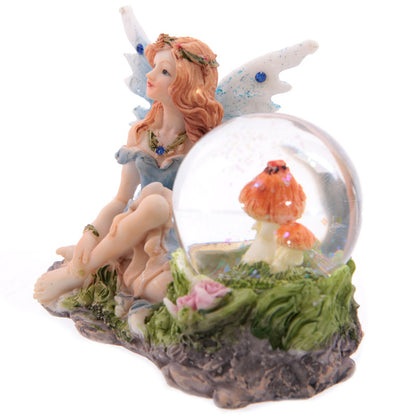 Fairy surrounded by flowers in a shimmering waterball